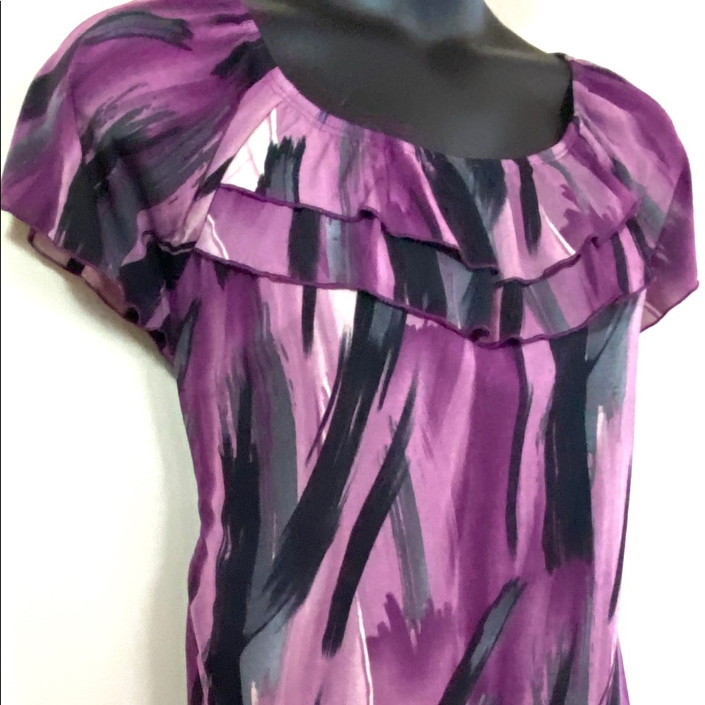 Dressy top with Ruffled neckline.
